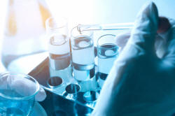 Researcher with glass laboratory chemical test tubes with liquid  Premium Photo